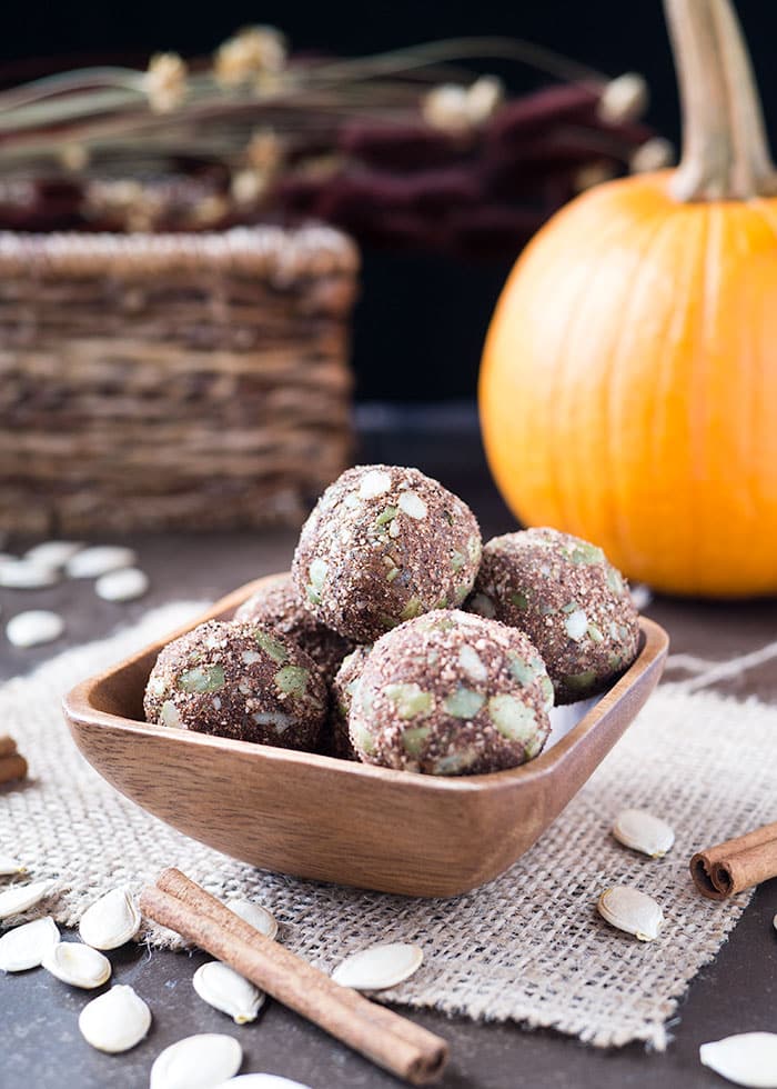 several chai pumpkin bliss balls in a wooden bowl