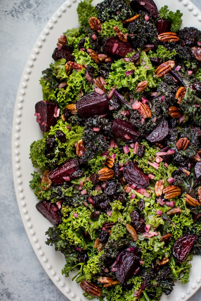 close-up of beet and kale salad with pecans and cranberries