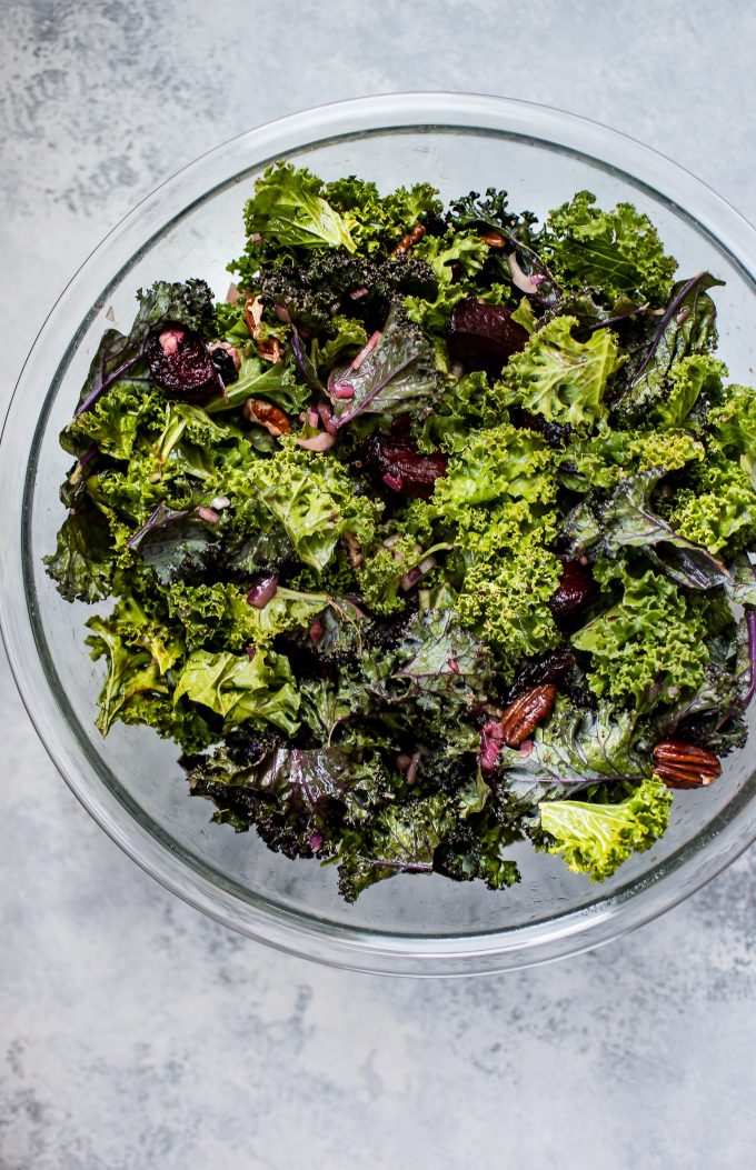 glass serving bowl with vegetarian roasted beet and kale salad