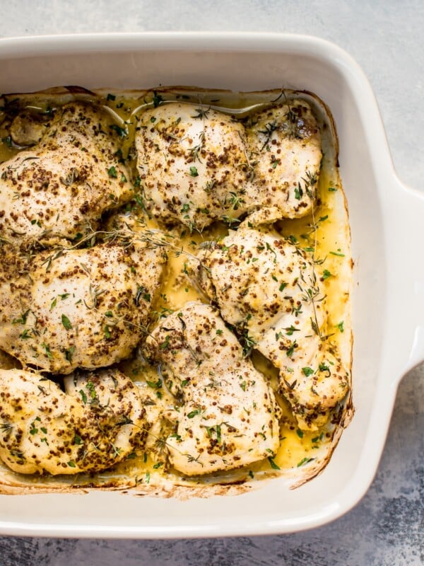 These easy roasted mustard chicken thighs have only a handful of ingredients and come together fast with minimal effort. They stay succulent and juicy, and you will love the light pan sauce.