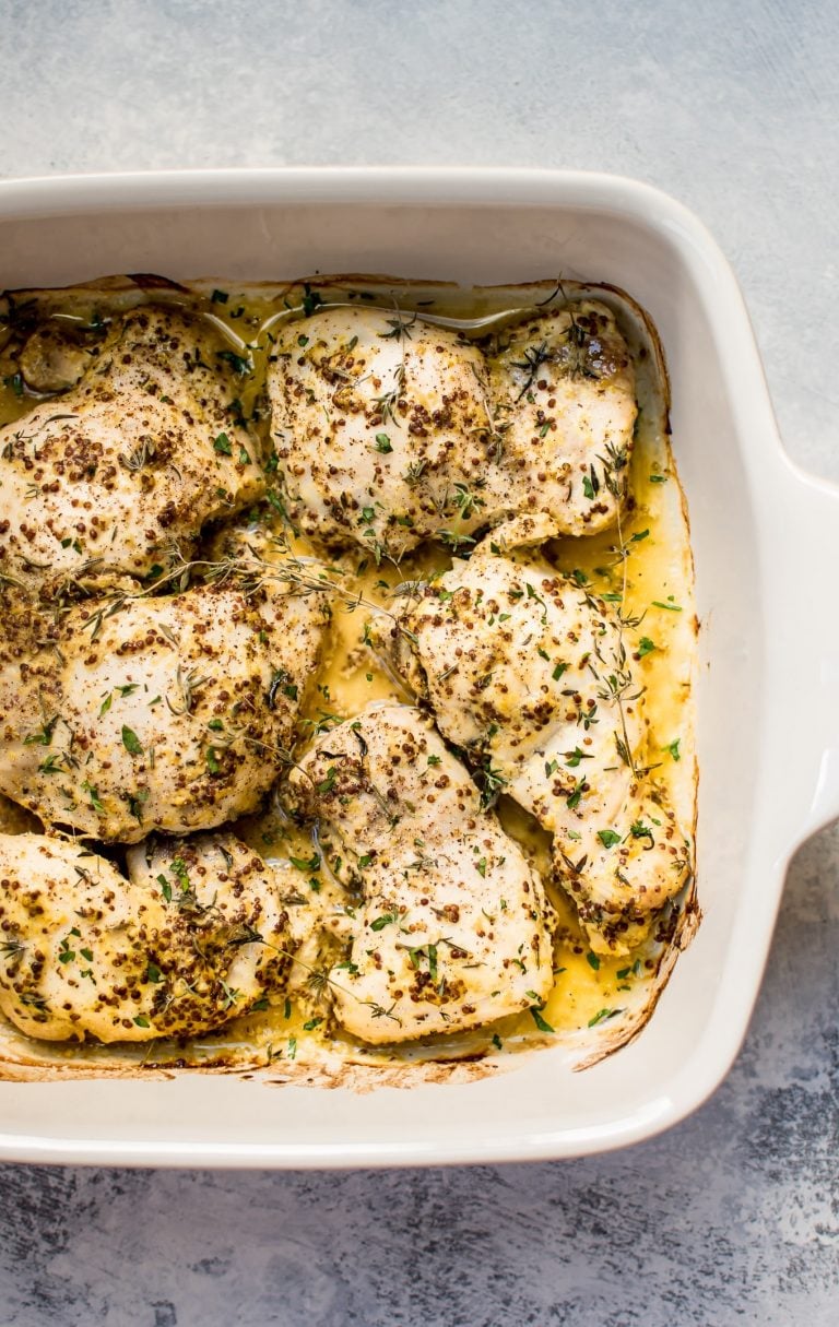 These easy roasted mustard chicken thighs have only a handful of ingredients and come together fast with minimal effort. They stay succulent and juicy, and you will love the light pan sauce.