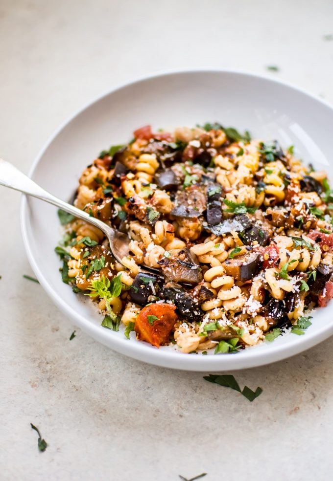 bowl of healthy spicy eggplant pasta with a fork