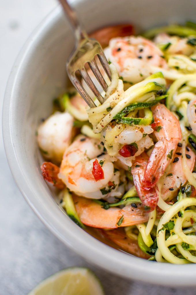close-up of sweet chili shrimp zoodles on a fork