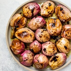These whole roasted shallots make a tasty and beautiful addition to your dinner table! Balsamic vinegar and butter add an extra special touch to this easy vegetable side dish.