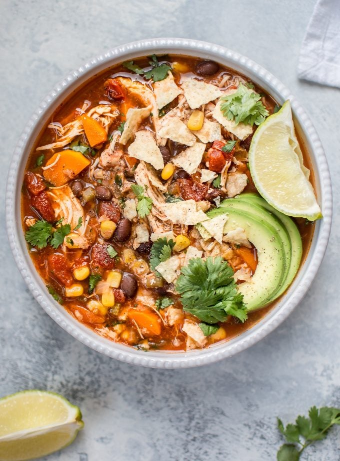 bowl of Crockpot Mexican chicken soup topped with avocado