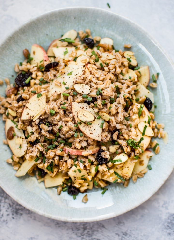 This healthy vegan farro salad is packed with dried cranberries, sliced almonds, honeycrisp apple slices, chives, and a lemon vinaigrette. It makes a wonderful light lunch or side dish.