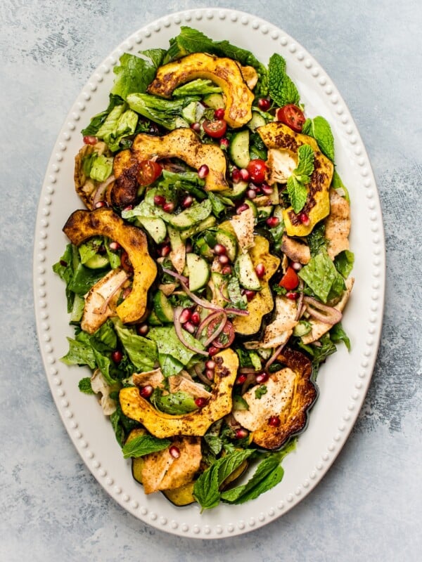 This fall fattoush salad recipe is fresh, bright, healthy, and given an autumn twist with roasted acorn squash. A beautiful addition to your dinner table!  