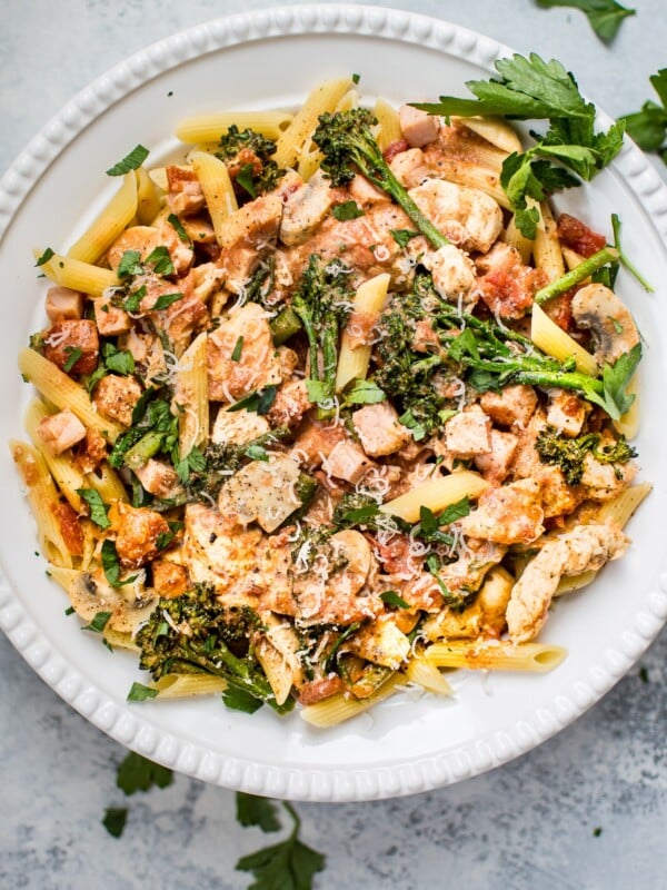 This lighter chicken and bacon pasta is made healthier with Canadian bacon, lean chicken breast, half-and-half, and fresh vegetables. Cajun spices and plenty of garlic take the flavor to the next level!