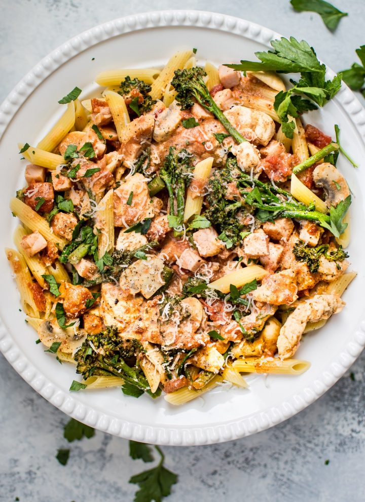 This lighter chicken and bacon pasta is made healthier with Canadian bacon, lean chicken breast, half-and-half, and fresh vegetables. Cajun spices and plenty of garlic take the flavor to the next level!