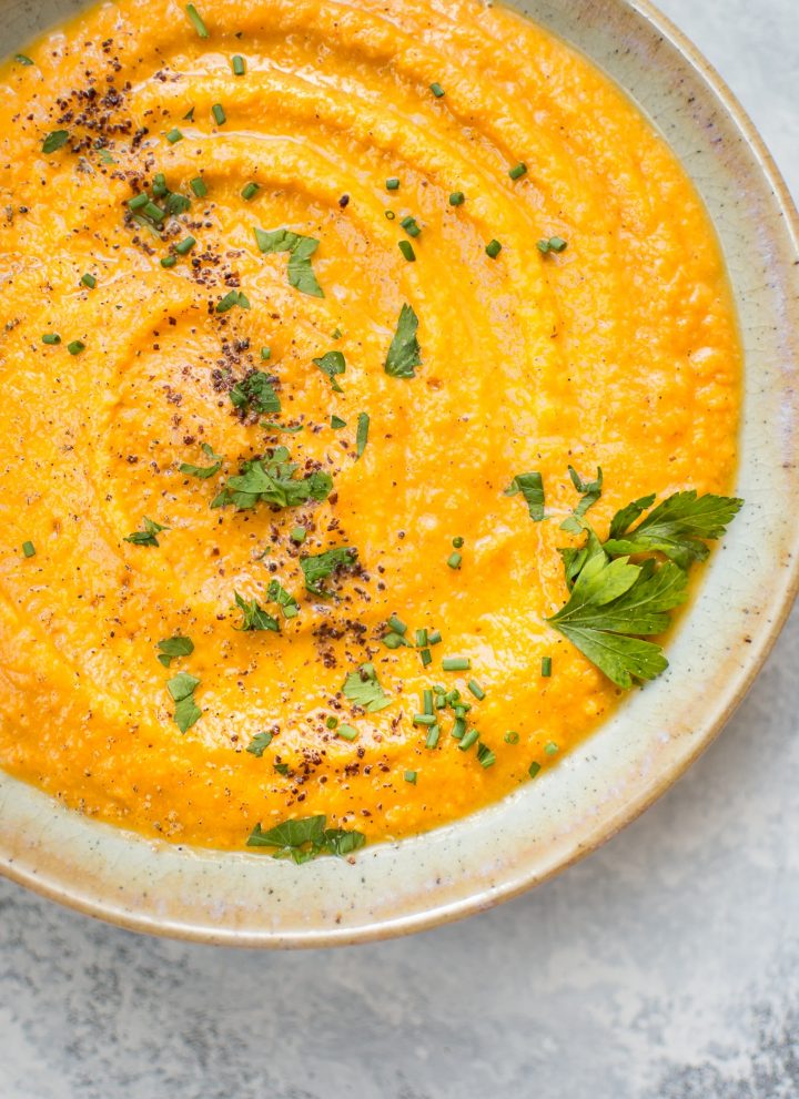 This vegan pumpkin and red lentil soup is hearty, healthy, and comforting. A delicious fall soup idea!
