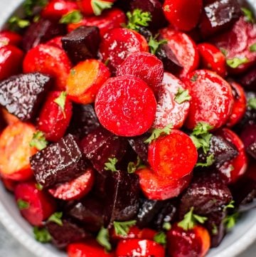This maple roasted beets and carrots recipe is an easy, colorful, and healthy side dish. Perfect for your holiday table!