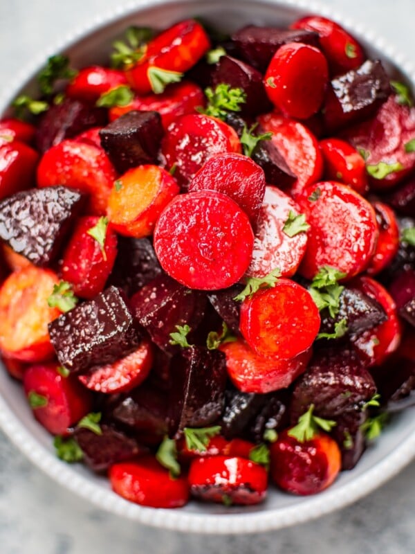 This maple roasted beets and carrots recipe is an easy, colorful, and healthy side dish. Perfect for your holiday table!