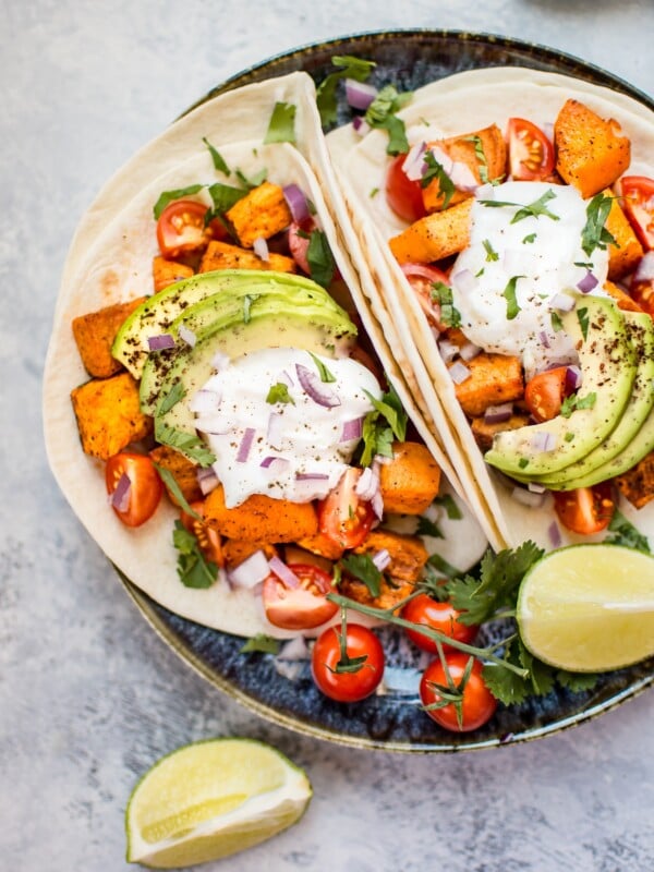 This roasted sweet potato tacos recipe makes a delicious, filling, and nutritious meat-free meal! Load 'em up with your favorite toppings and enjoy these all season long.