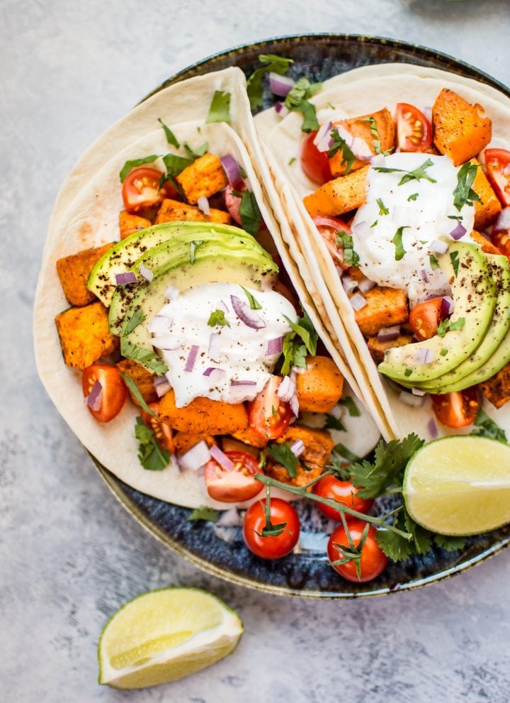 This roasted sweet potato tacos recipe makes a delicious, filling, and nutritious meat-free meal! Load 'em up with your favorite toppings and enjoy these all season long.