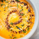 This spicy chipotle sweet potato soup is a healthy and flavorful vegan soup with a nice kick of heat! It's wonderfully silky and will really warm you up this fall.