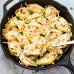 This lemon chicken stuffed shells recipe is easy, cheesy, and delicious. Three different kinds of cheeses and flavorful lemon chicken are baked to melty perfection. This recipe makes an awesome comfort food dinner!