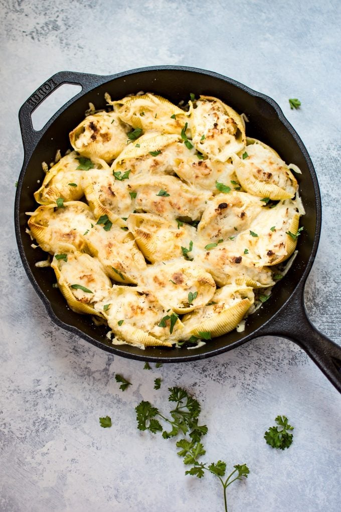 easy lemon chicken stuffed shells in a cast iron pan