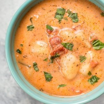 This creamy tomato gnocchi soup is easy, comforting, and comes together fast. The pillowy gnocchi make this the best tomato soup ever.