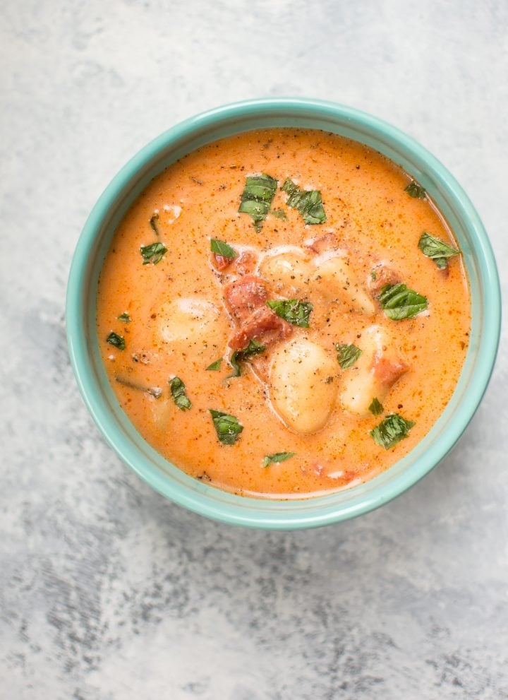 This creamy tomato gnocchi soup is easy, comforting, and comes together fast. The pillowy gnocchi make this the best tomato soup ever.