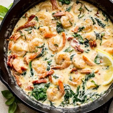 These Tuscan shrimp have an amazing creamy garlic butter sauce with sun-dried tomatoes, basil, and spinach. This quick and easy recipe is low-carb keto. 
