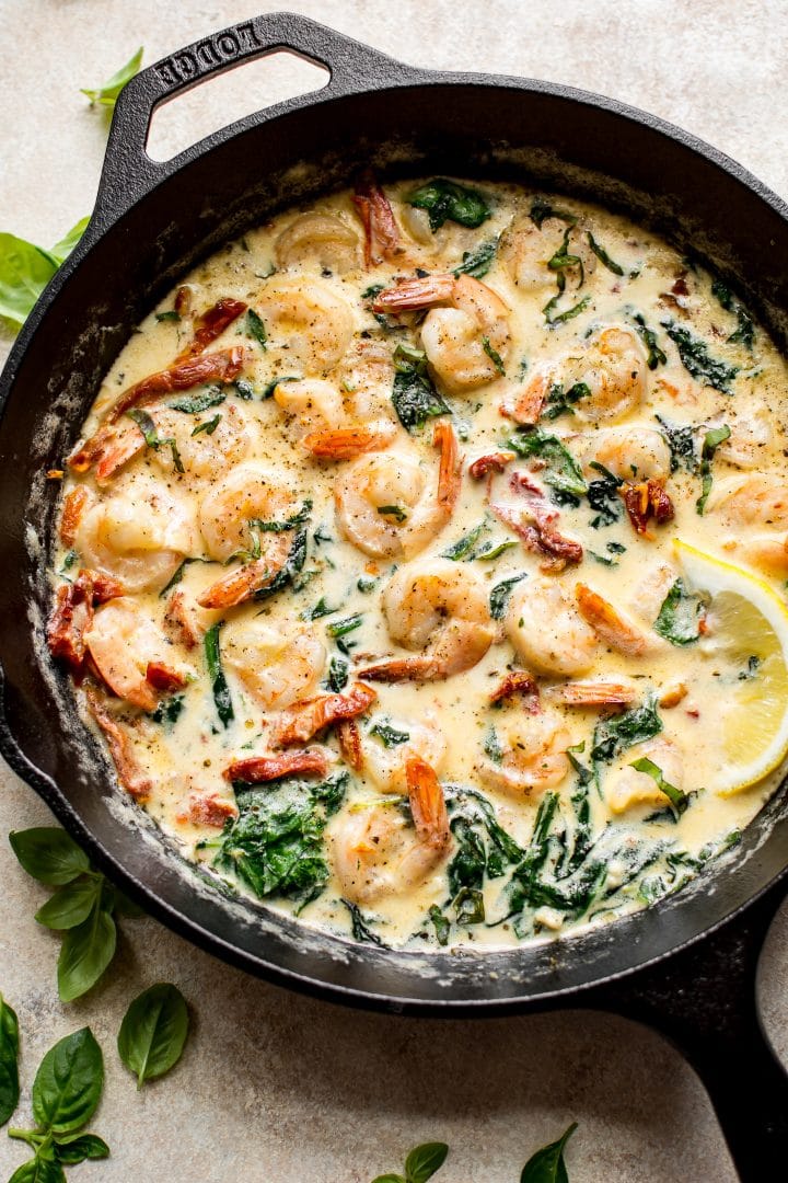 These Tuscan shrimp have an amazing creamy garlic butter sauce with sun-dried tomatoes, basil, and spinach. This quick and easy recipe is low-carb keto. 