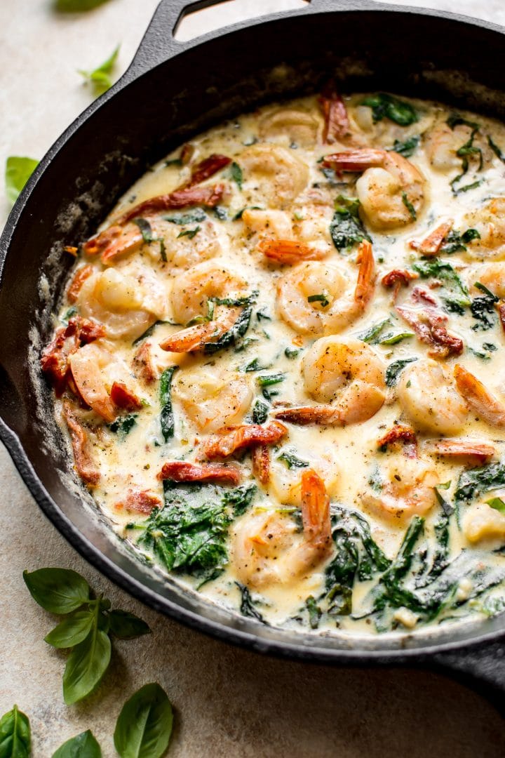 Creamy Tuscan garlic shrimp - a simple low-carb dinner with a sun-dried tomato, basil, spinach, and lemon sauce.