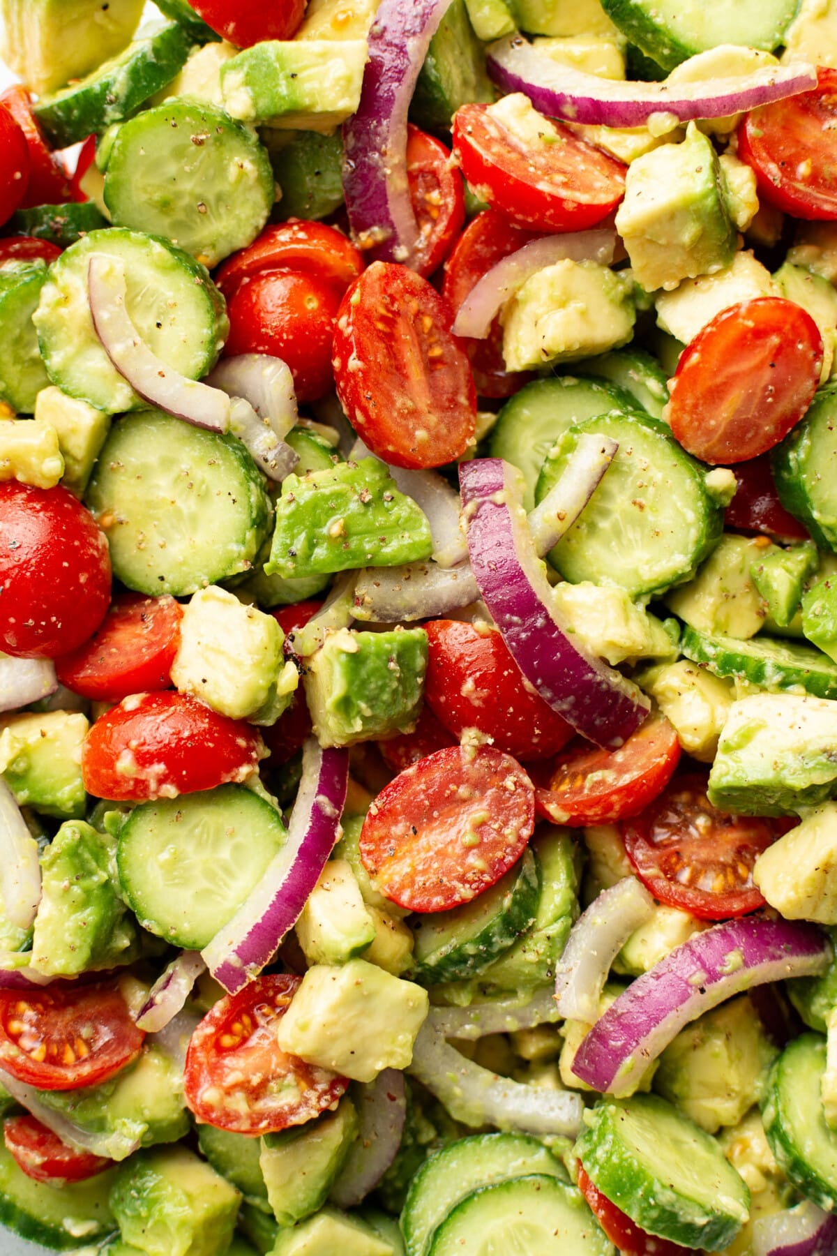 closeup of cucumber tomato avocado salad