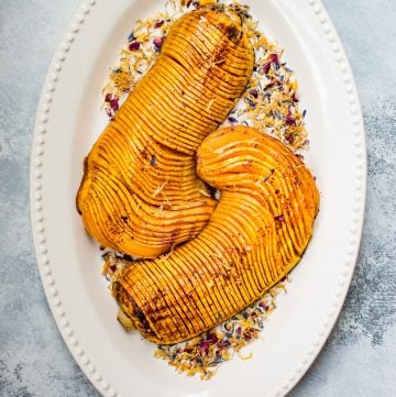 Honey cinnamon roasted hasselback butternut squash is a showstopping vegetarian side dish that would look perfect on your Thanksgiving table!