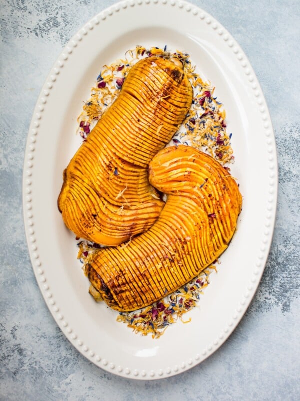 Honey cinnamon roasted hasselback butternut squash is a showstopping vegetarian side dish that would look perfect on your Thanksgiving table!