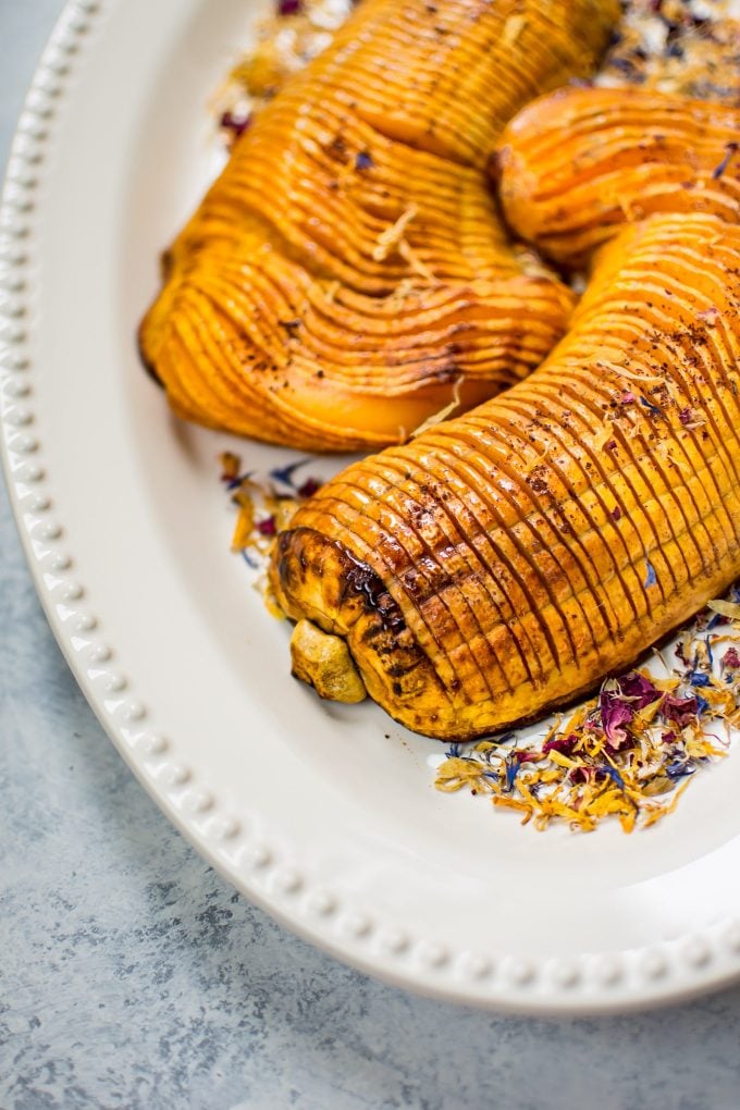 close-up of vegetarian honey hasselback butternut squash on a plate
