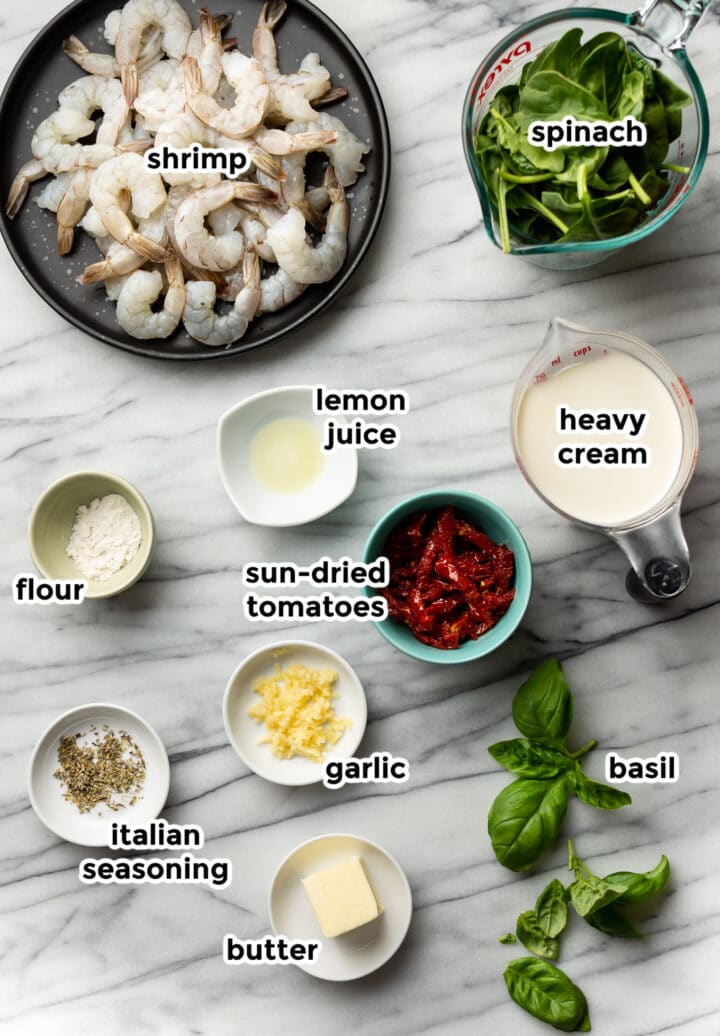 ingredients for tuscan shrimp on a marble surface