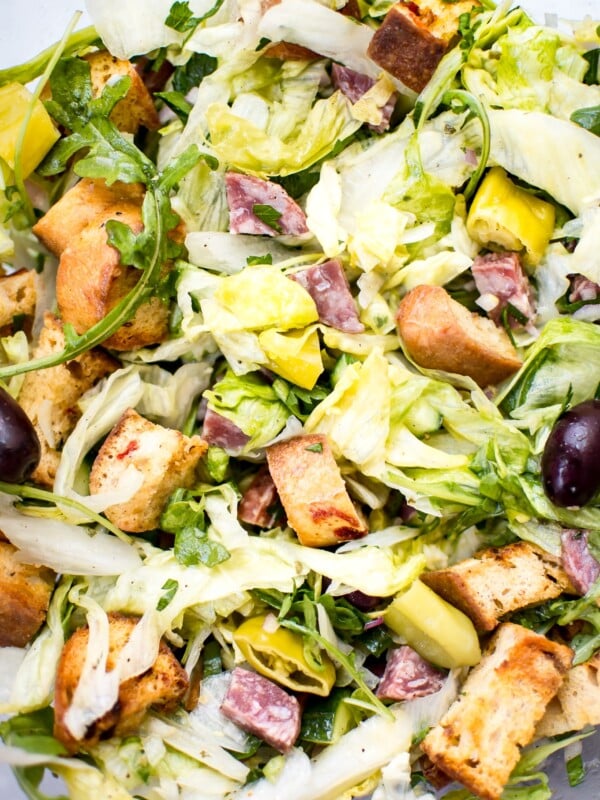 This Italian chopped salad recipe is easy, fast, and fresh. Salami, homemade croutons, and pepperoncini peppers make this one flavorful salad! 