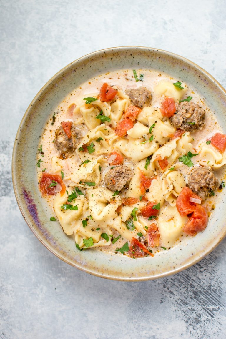 This Italian sausage and tortellini soup recipe is creamy, comforting, and very easy to make with very little prep time. 