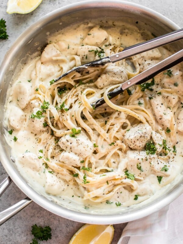 This easy chicken Alfredo recipe has a lemon, garlic, and parmesan cream sauce. It is so quick and simple to make cheesy homemade Alfredo sauce from scratch! Total comfort food. Serve with fettuccine or any kind of pasta.