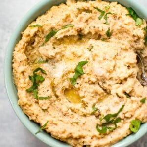 This easy roasted mashed cauliflower recipe is an easy, low-carb alternative to mashed potatoes. The cauliflower is roasted with garlic and an a delicious assortment of herbs and spices then puréed into a silky mash.