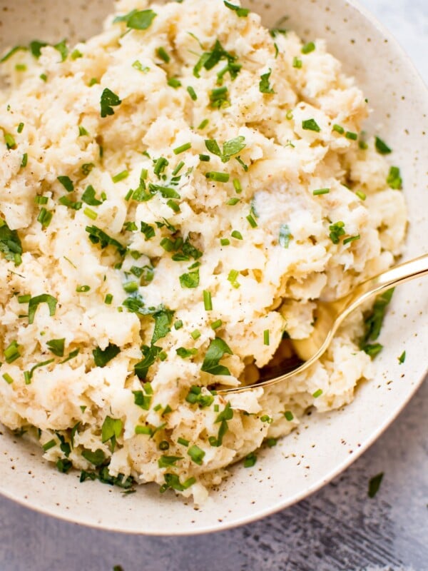 This rustic parsnip mash recipe is a delicious side dish with a nice kick of garlic and the fresh flavors of chives and parsley. 