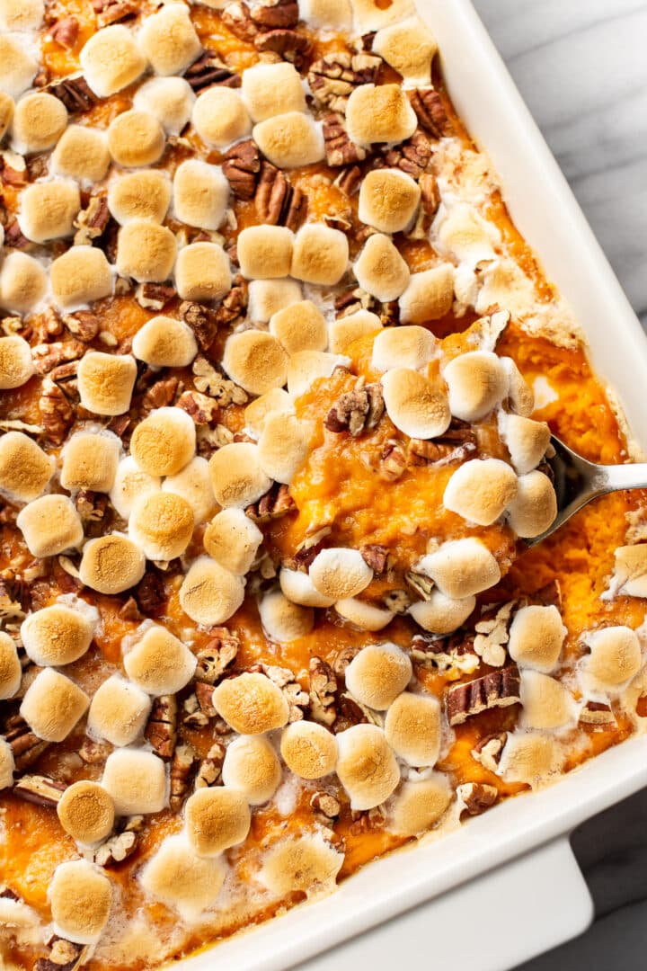 closeup of a serving spoon with sweet potato casserole