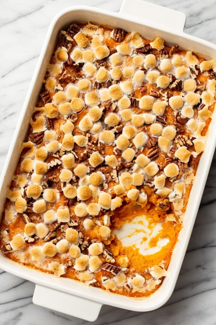 a baking dish with sweet potato casserole with marshmallows