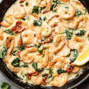 a cast iron skillet with creamy tuscan shrimp