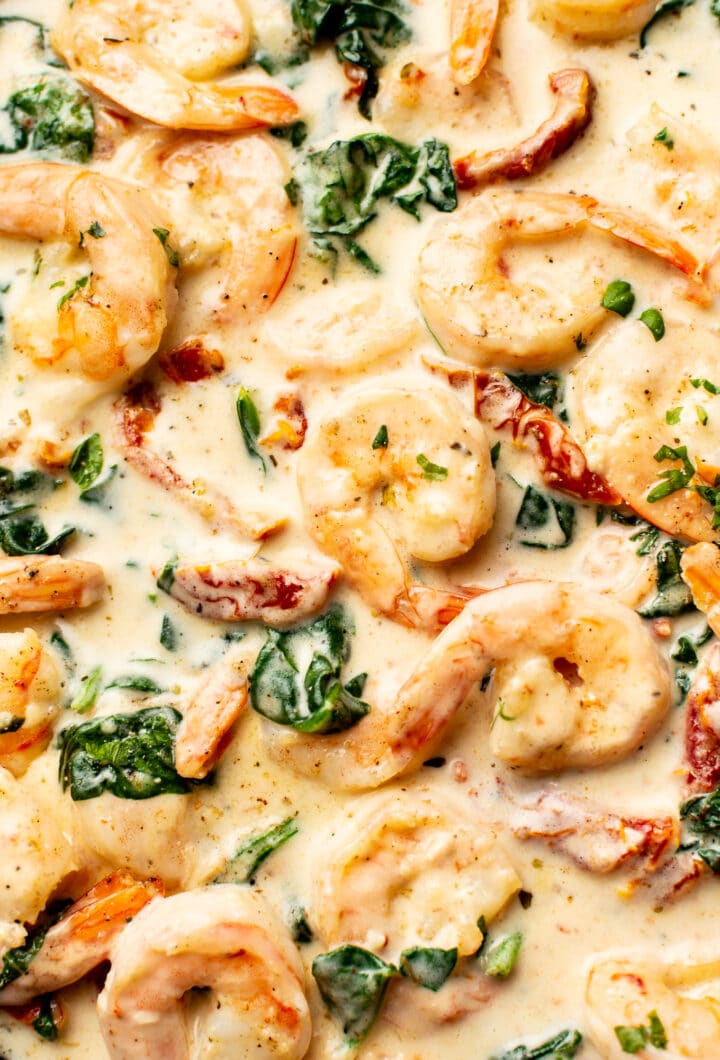 closeup of shrimp in a creamy tuscan sauce