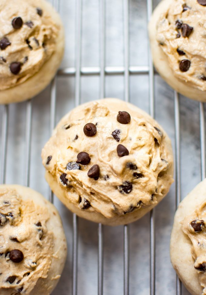 vegan chocolate chip cookie with vegan frosting on a wire rack close-up