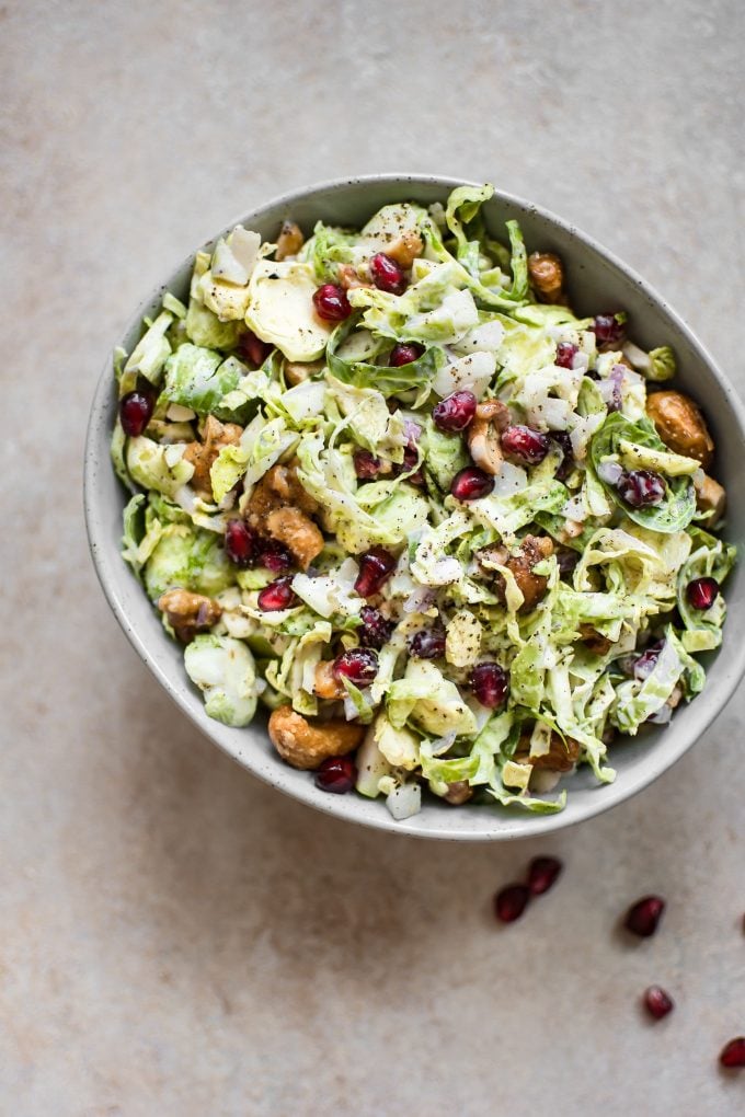 bowl of Brussels sprouts slaw with pomegranate and cashews