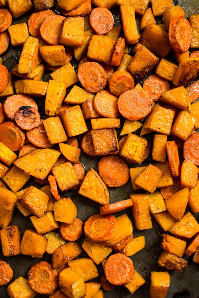 roasted carrots and squash on a baking sheet close-up
