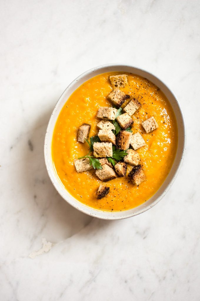 white bowl of butternut squash carrot soup