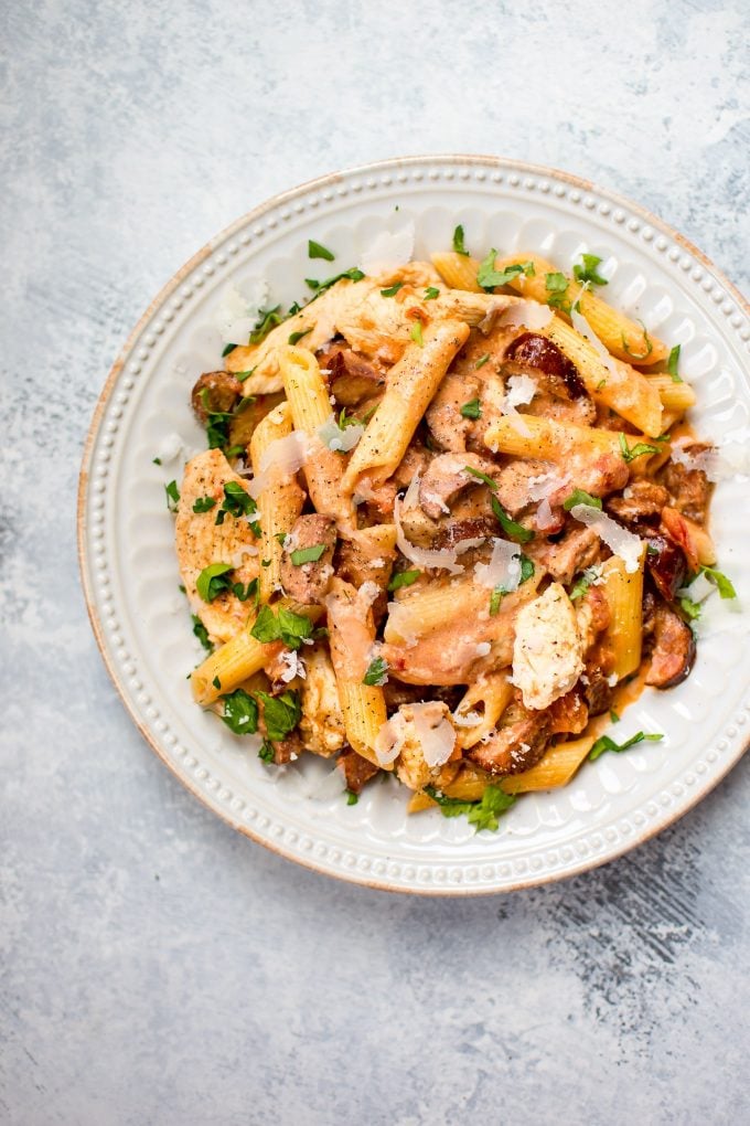 plate of chicken chorizo pasta with grated parmesan