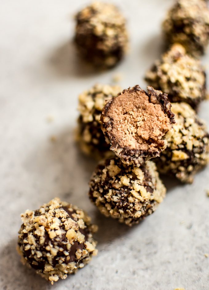 close-up of easy vegan coconut rum truffle with a bite taken