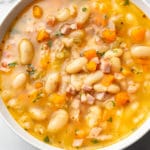 ham and bean soup (close-up in a white bowl)