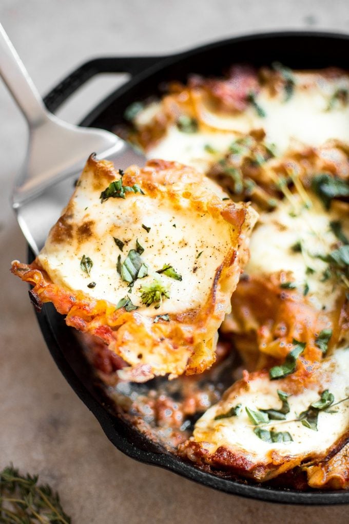 a serving spatula with a piece of healthy skillet lasagna