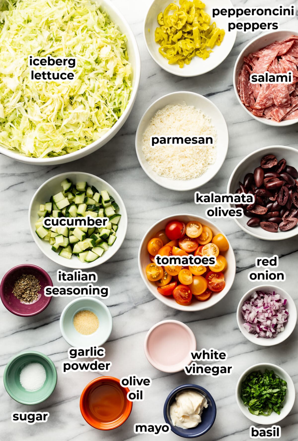 ingredients for italian chopped salad in prep bowls