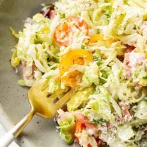 a bowl of italian chopped salad with fork